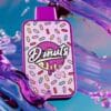 Grape Jelly Donuts By Fryd disposable vape cart with sweet, fruity grape flavor, donut undertones, smooth hits, premium THC live resin, authentic Fryd vape product